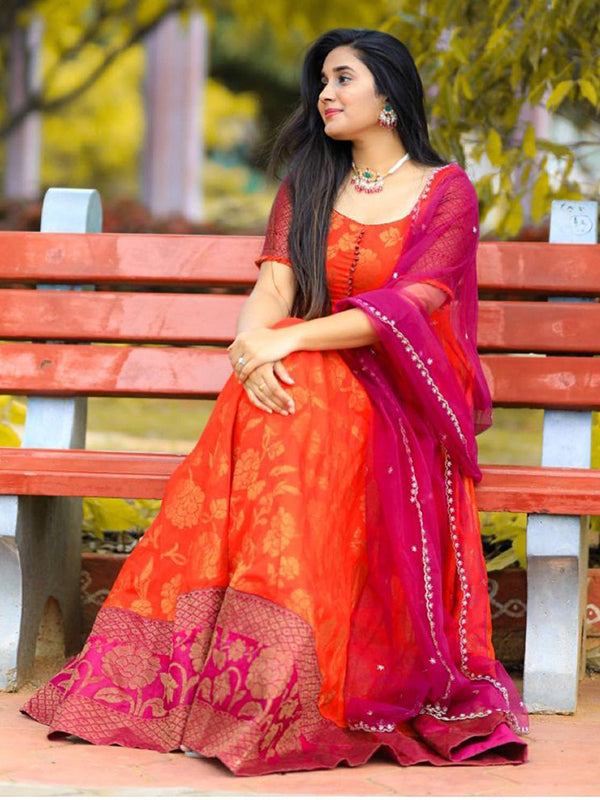 Orange Silk Gown With Net Dupatta
